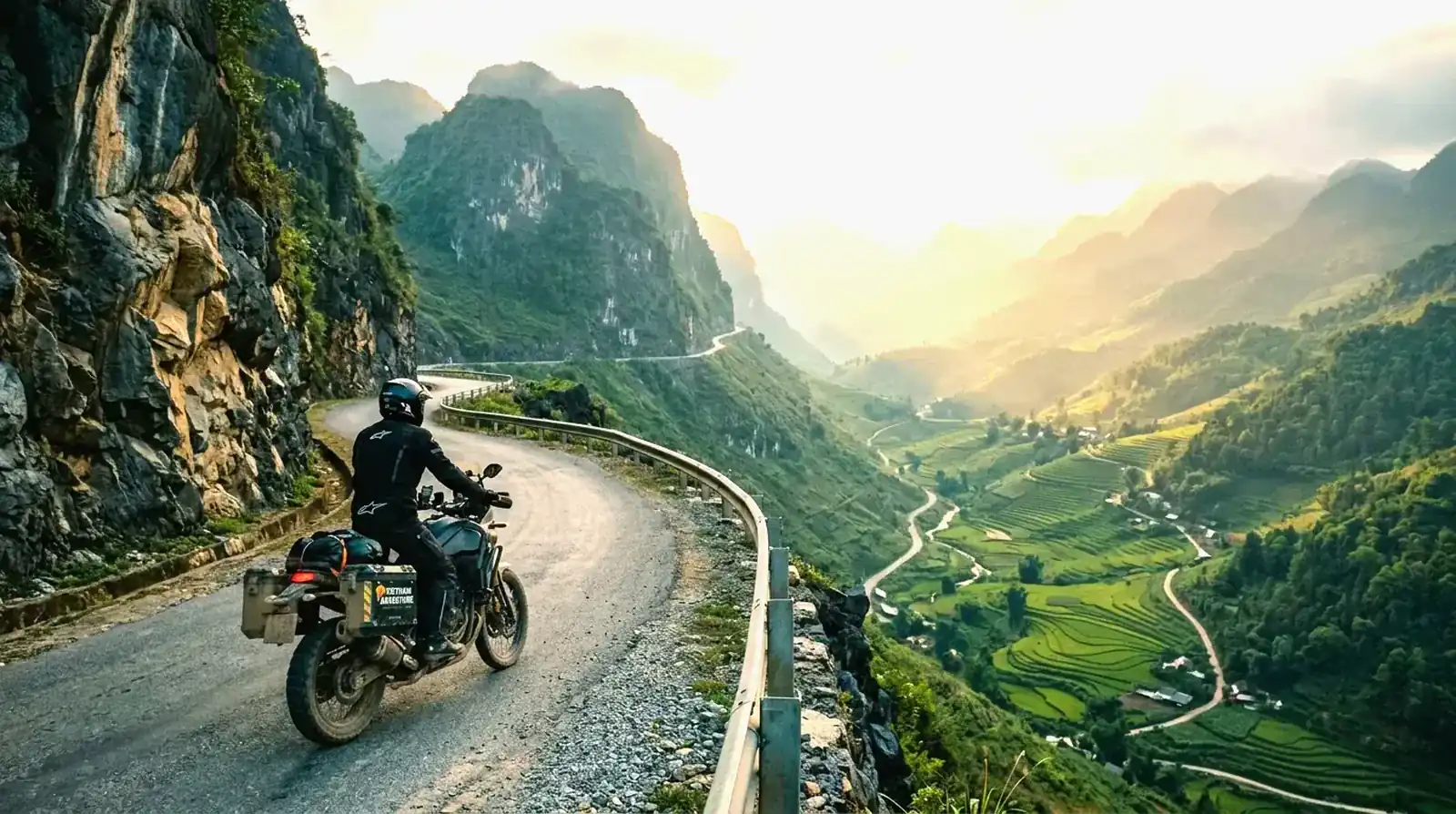 Lone rider crossing a Ha Giang mountain pass at dawn